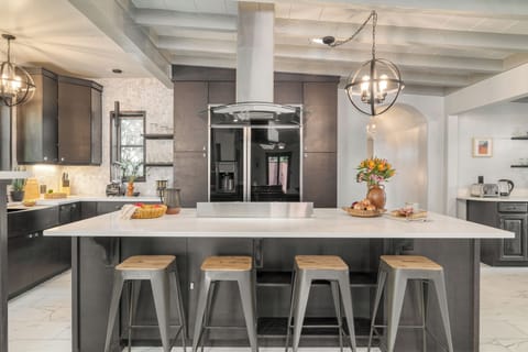 Gourmet chef's kitchen with high-end appliances.