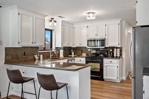 Bar seating is a bonus, and full kitchen features all the expect