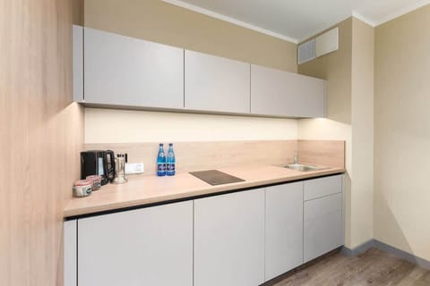 The fully equipped kitchenette includes everything you need for a home-cooked meal.
