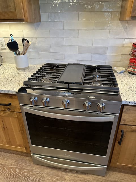 New gas range and oven, fully stocked with pots, pans, and more!