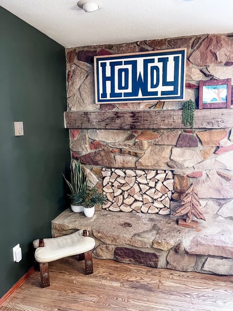 A Warm Welcome: This cozy corner sets the tone with rustic stonework, playful touches, and a big “Howdy” to greet you. Whether you're kicking off your boots or just soaking in the cabin vibes, it’s a space full of personality and charm.