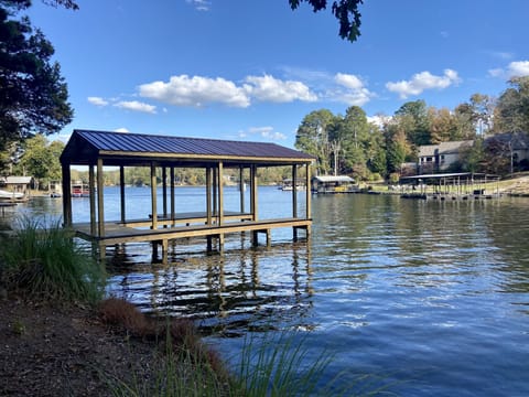 Single stall boat dock with large swim deck