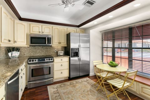 Fridge, oven, stovetop, dining tables