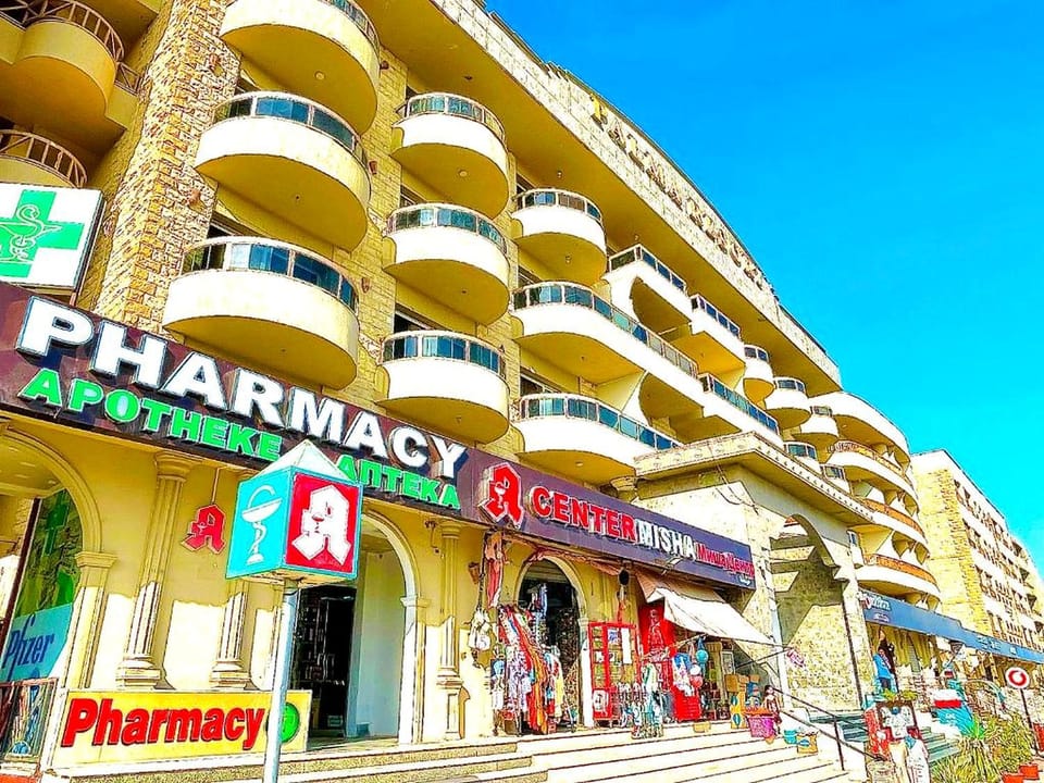 Property building, Day, People, Property logo or sign, Neighbourhood, On-site shops, Logo/Certificate/Sign, Text overlay, City view, Street view, Supermarket/grocery shop, Shopping Area, group of guests, Certificate/Award