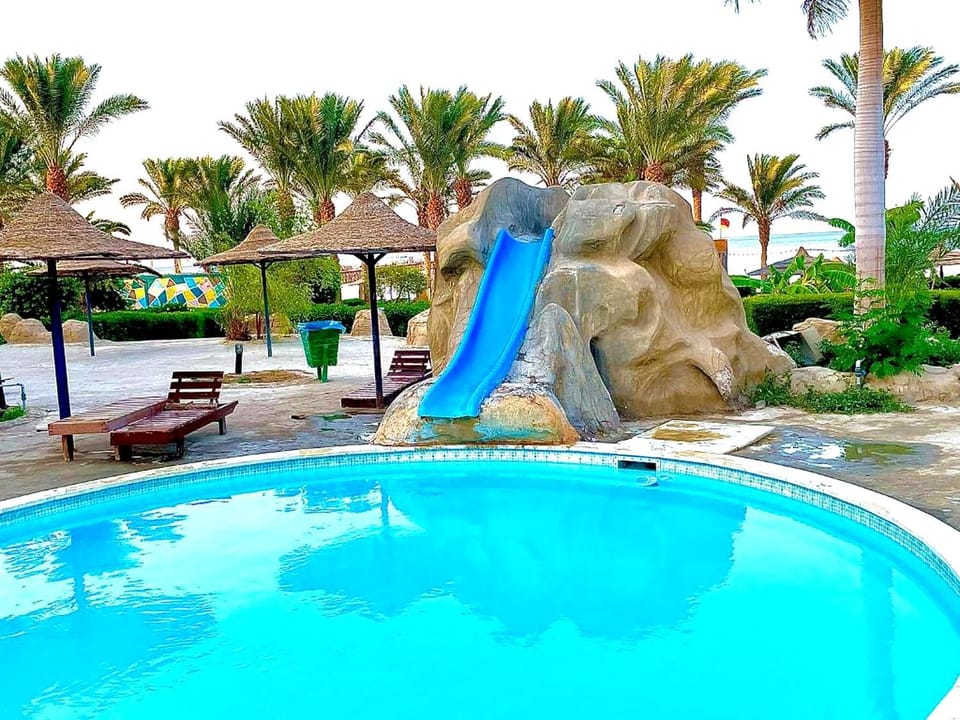 Communal lounge/ TV room, Day, Children play ground, Aqua park, Evening entertainment, Pool view, Swimming pool, sunbed