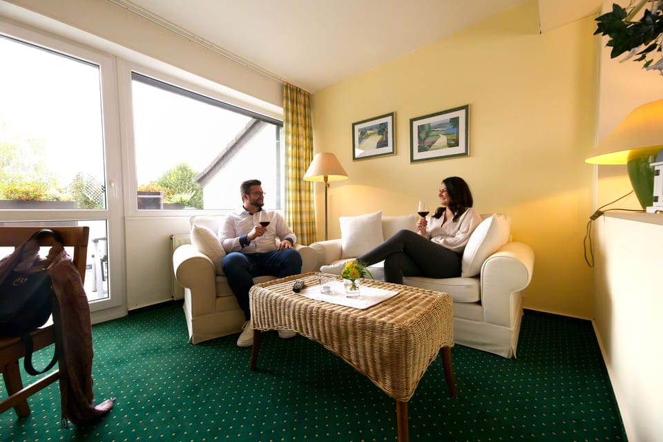 Superior Double Room, Balcony | Living area | 81-cm flat-screen TV with cable channels, TV