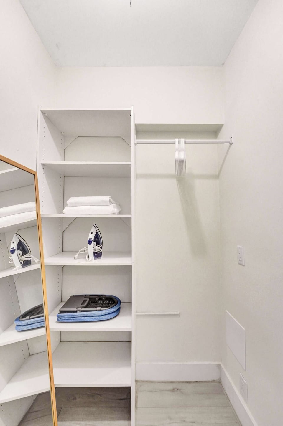 Bright walk-in closet with open shelving