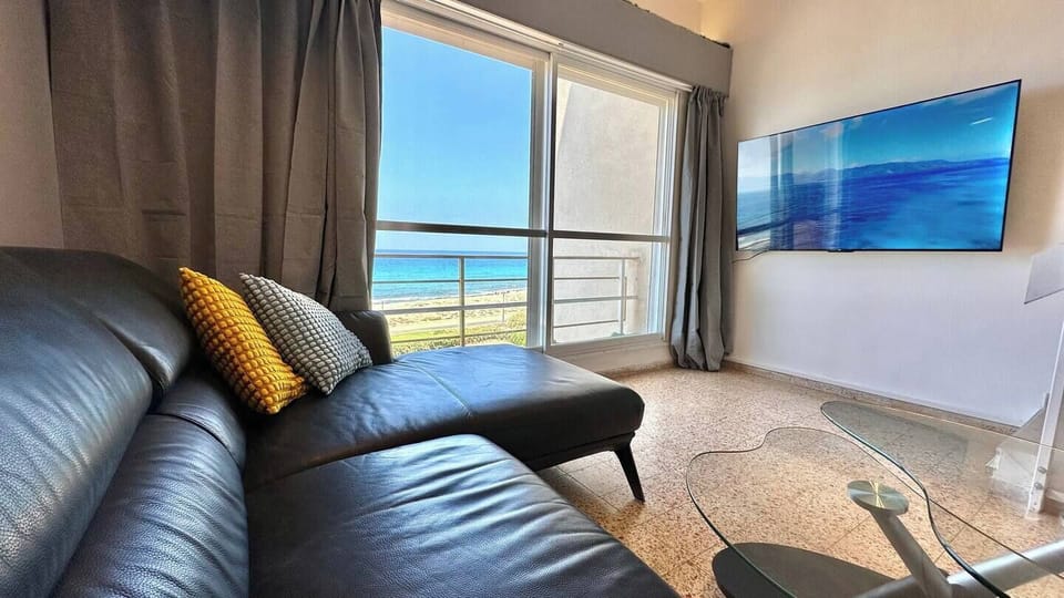 Romantic Apartment, 1 Double Bed, Sea View, Poolside | Living area | 65-inch LED TV with digital channels