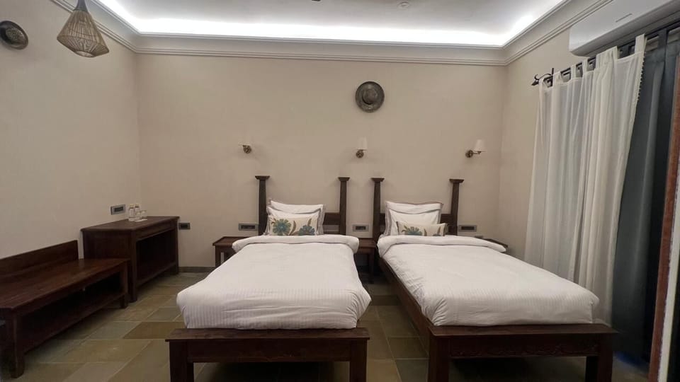 Deluxe Twin Room, Garden View | Living area