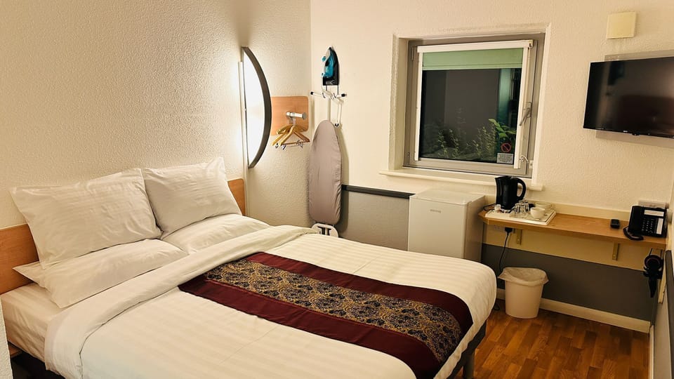 Standard Double Room | Blackout drapes, iron/ironing board, WiFi (free), bed sheets