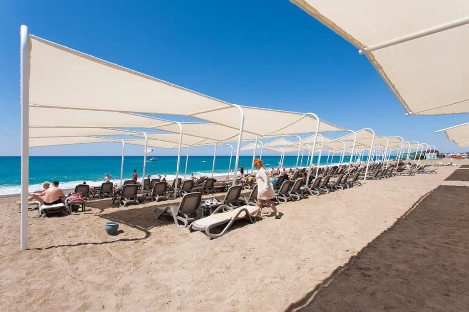 Private beach, free beach shuttle, sun loungers, beach umbrellas