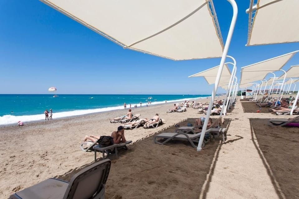 Private beach, free beach shuttle, sun loungers, beach umbrellas