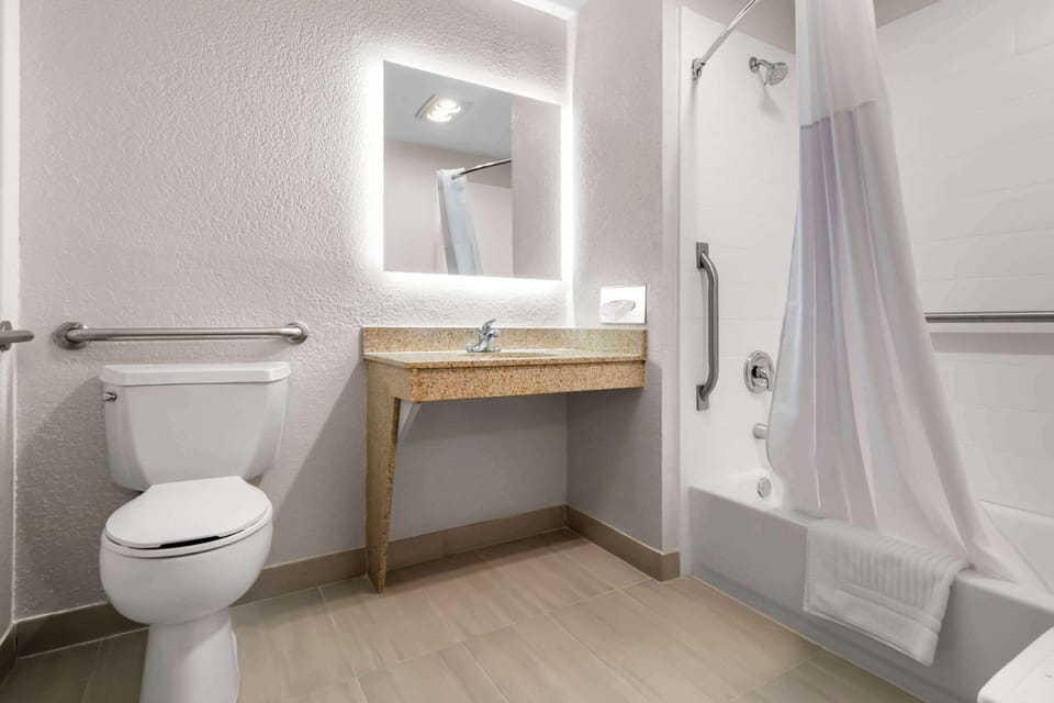 Suite, 1 King Bed, Non Smoking (Sofa Bed, Walk in shower) | Desk, blackout drapes, iron/ironing board, WiFi (free)