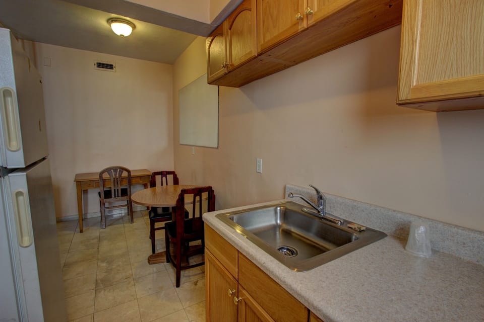 Suite, 2 Double Beds | Private kitchen | Fridge