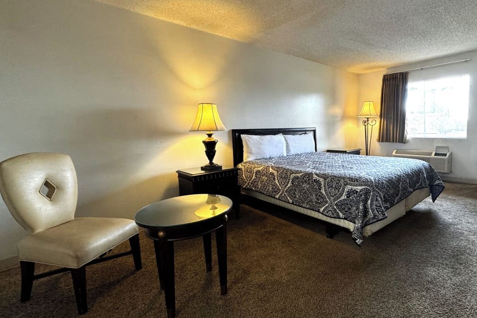 Desk, iron/ironing board, bed sheets