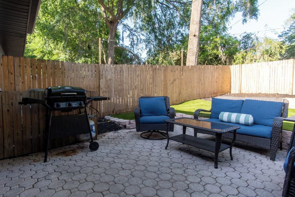 Outdoor patio in daytime. Propane grill provided *guest maintained