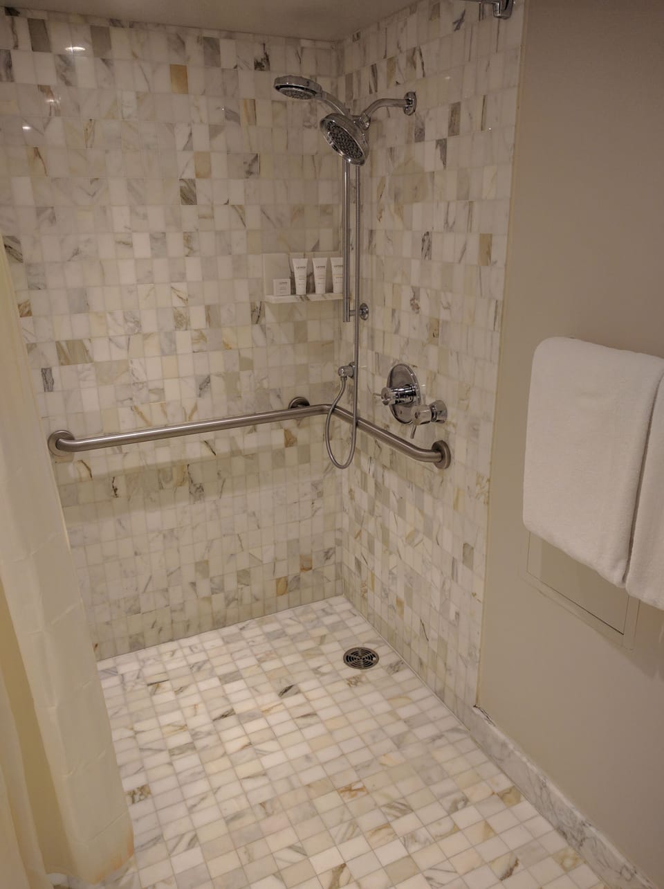 Shower, designer toiletries, hair dryer, towels