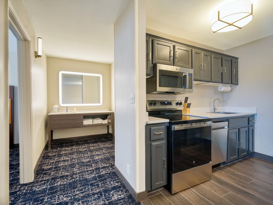 Family Suite, 2 Queen Beds | Desk, iron/ironing board, WiFi (free), bed sheets