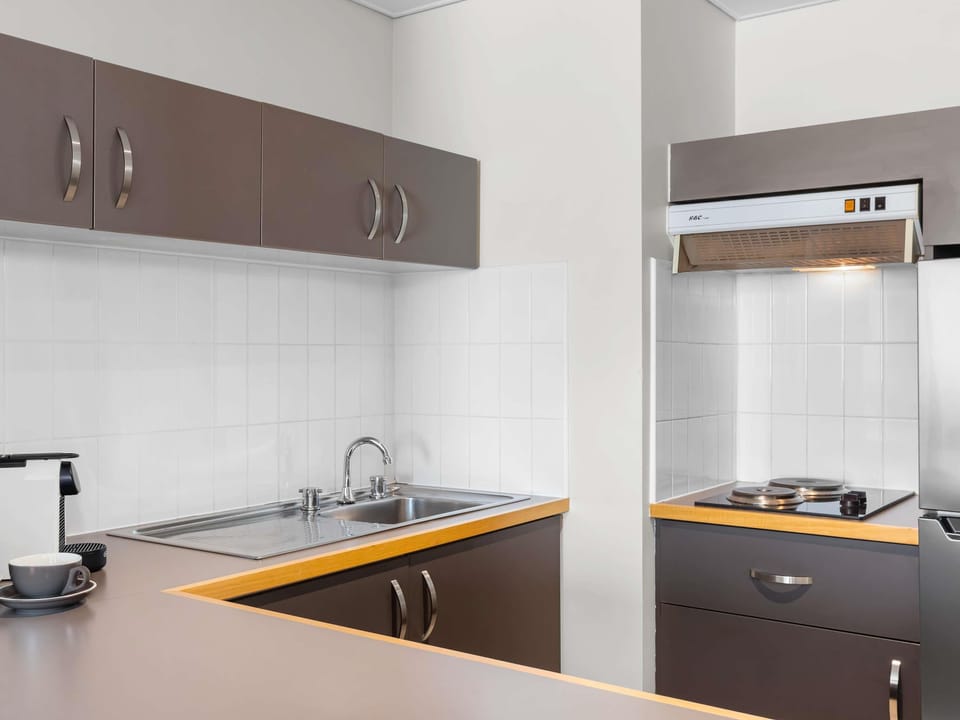 Executive Suite | Private kitchen | Coffee/tea maker, fridge, electric kettle