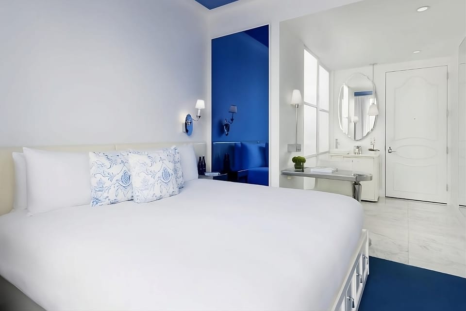 Unwind in a bright, modern room with soothing blue accents.